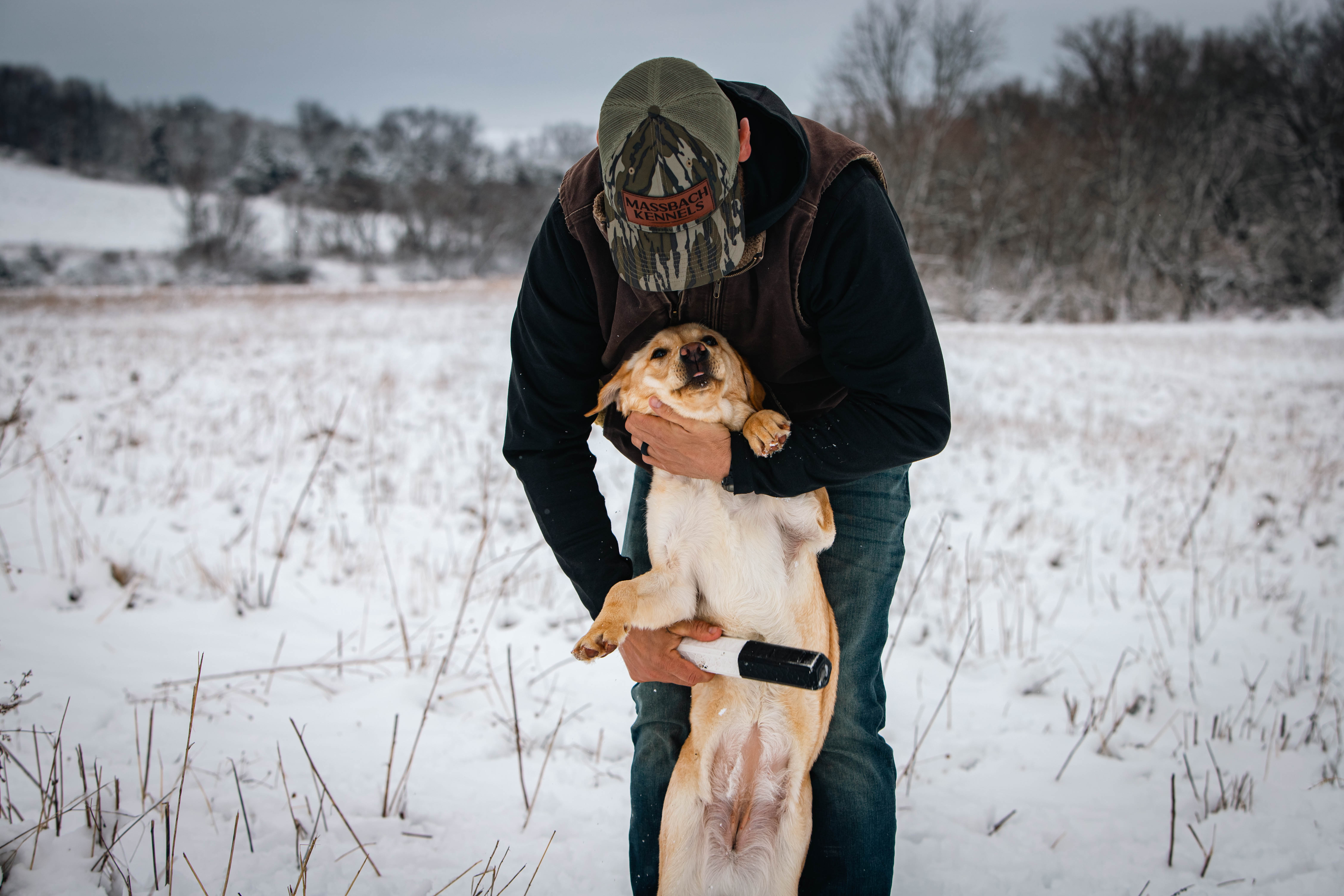 Justin with yellow lab puppy at Massbach Kennels